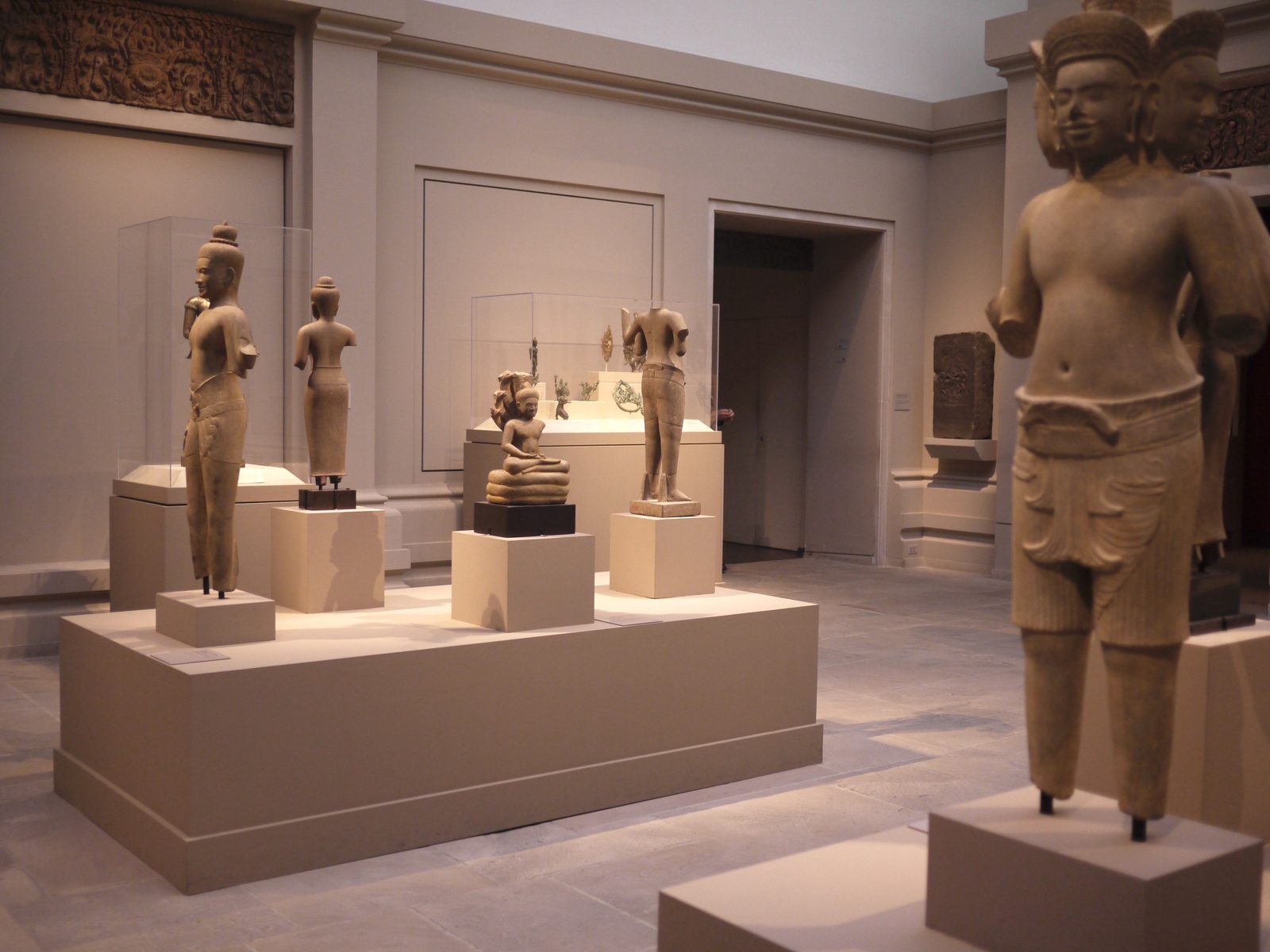 Khmer statues on display in a museum gallery